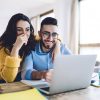Happy Couple Looking at Computer
